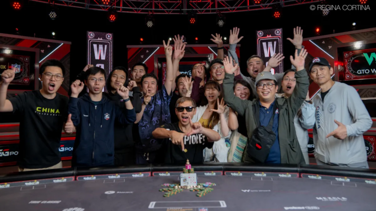 Xixiang Luo celebrates with his rail after winning his second bracelet of the summer.